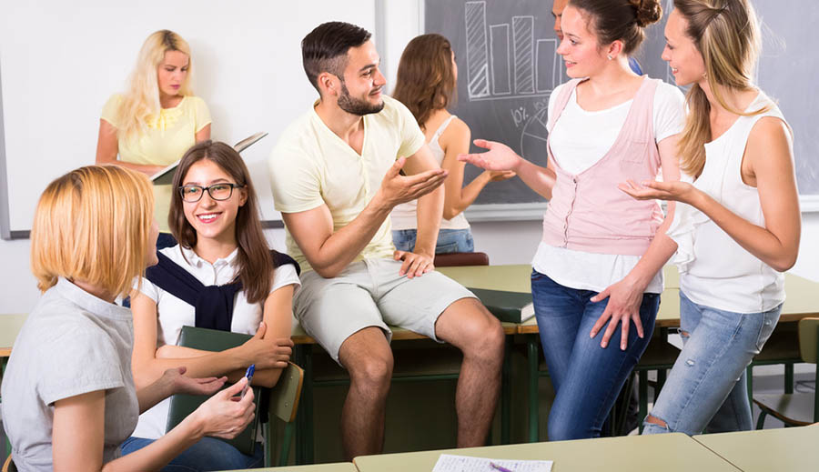 Group of men and women students studying together