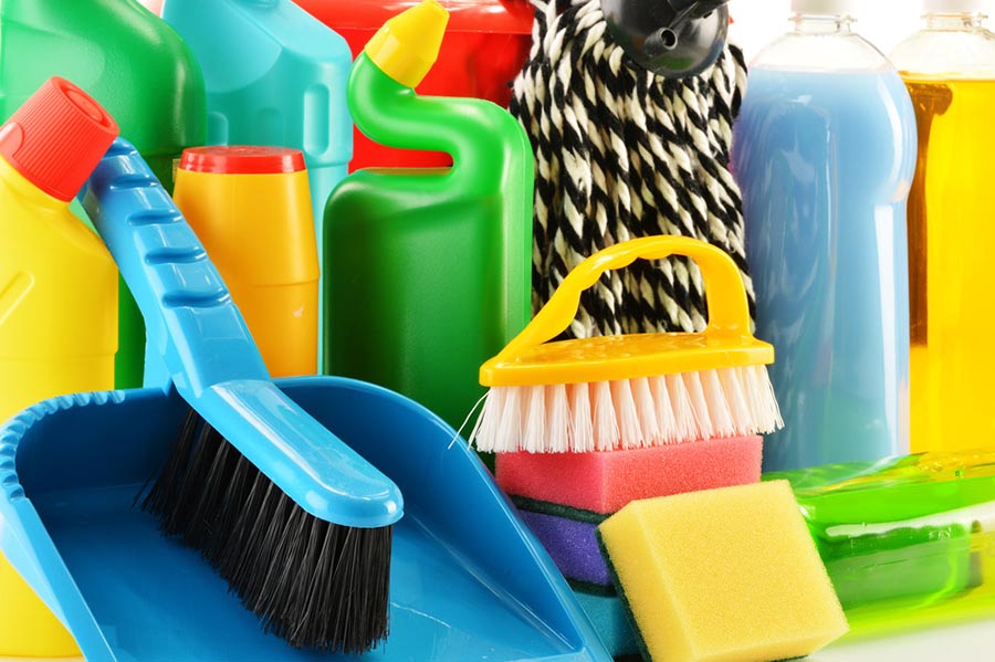 Close up of cleaning supplies stacked together