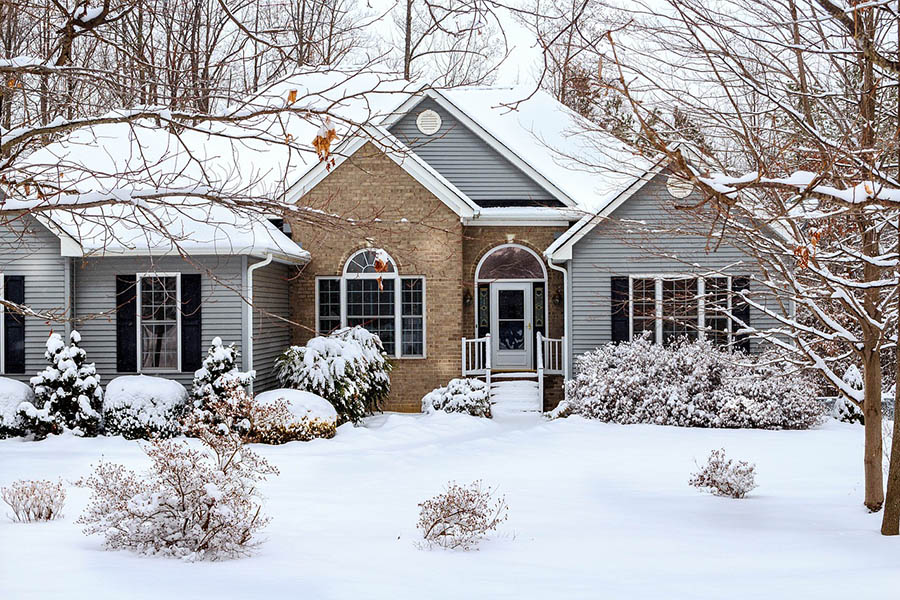 Large detached home after a snowfall