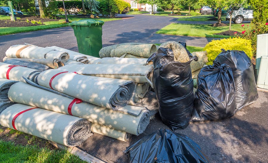 Pile of rugs and garbage from a sewer backup