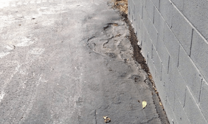 Result of a driveway that has been damaged by frost heave