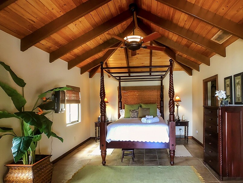 Master bedroom with beams of exposed wood