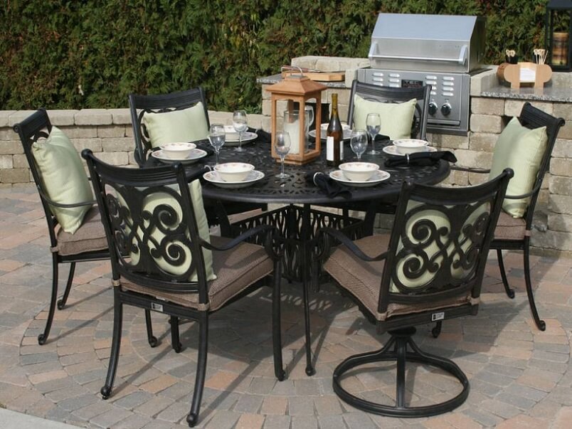 round aluminum table for an outdoor seating area