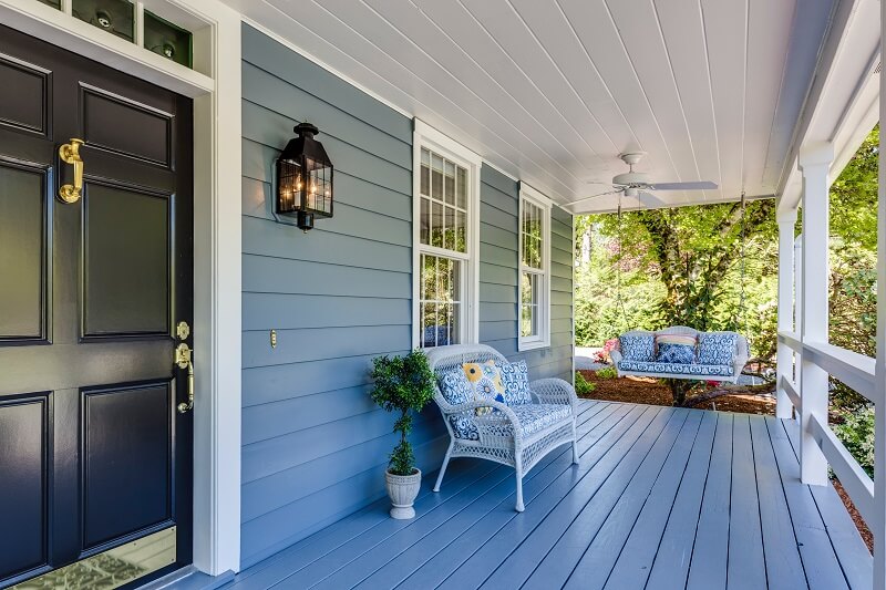 Large home patio with seating area and swinging benches