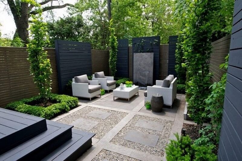 Empty patio space with modern furniture and stone work