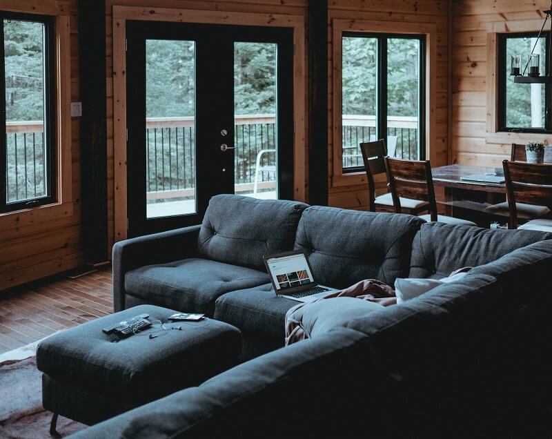 Cozy cabin with dark sectional couch