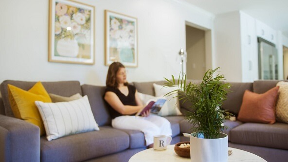 Women in bright new living room