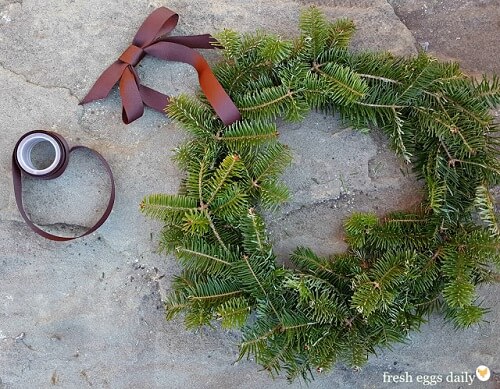 Classic evergreen branch with ribbon wreath