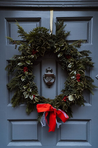 Large outdoor wreath on a blue door