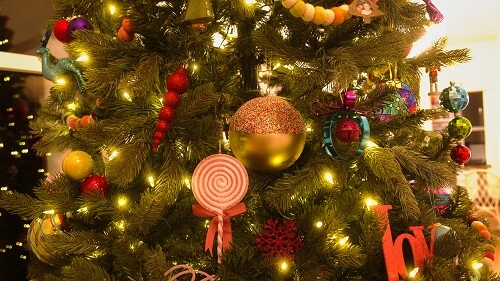 Large gold and red ornament in a Christmas tree