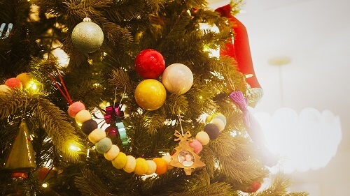 Group of colourful ornaments on a tree