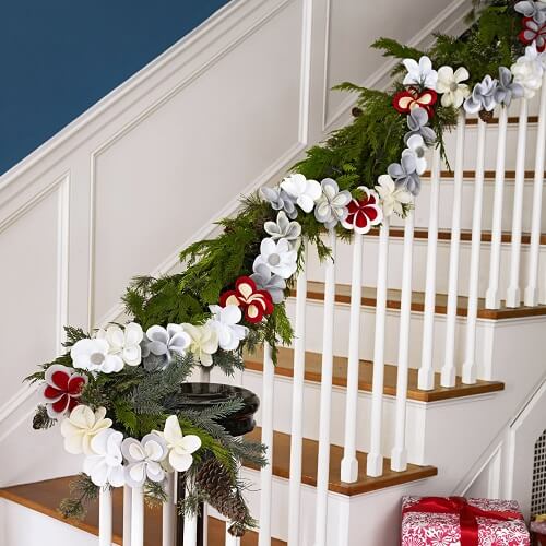 Large flower and evergreen garland on a railing