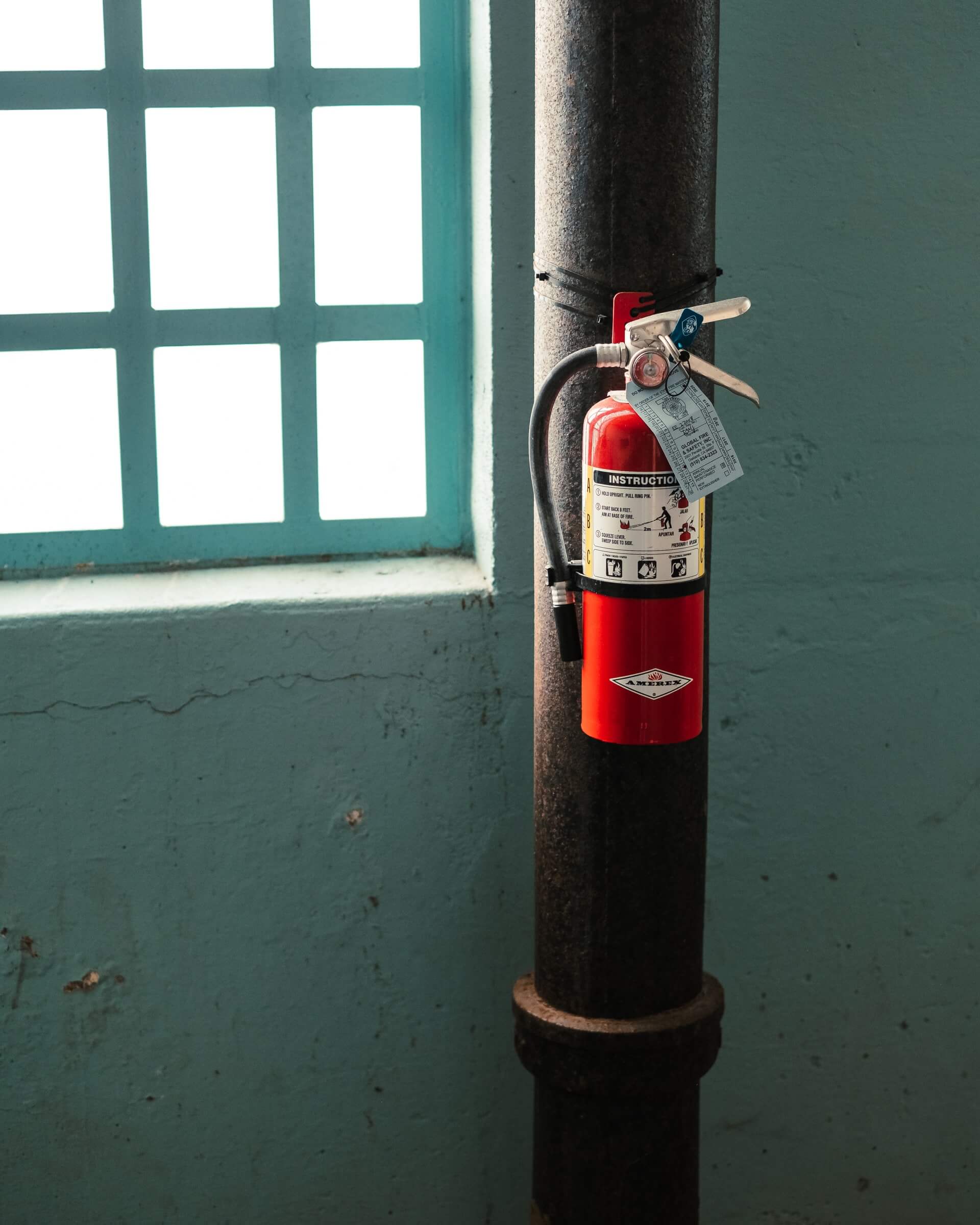 Fire extinguisher next to a window