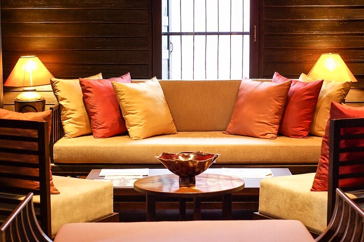 Colourful silk pillows on a couch in an upscale living room