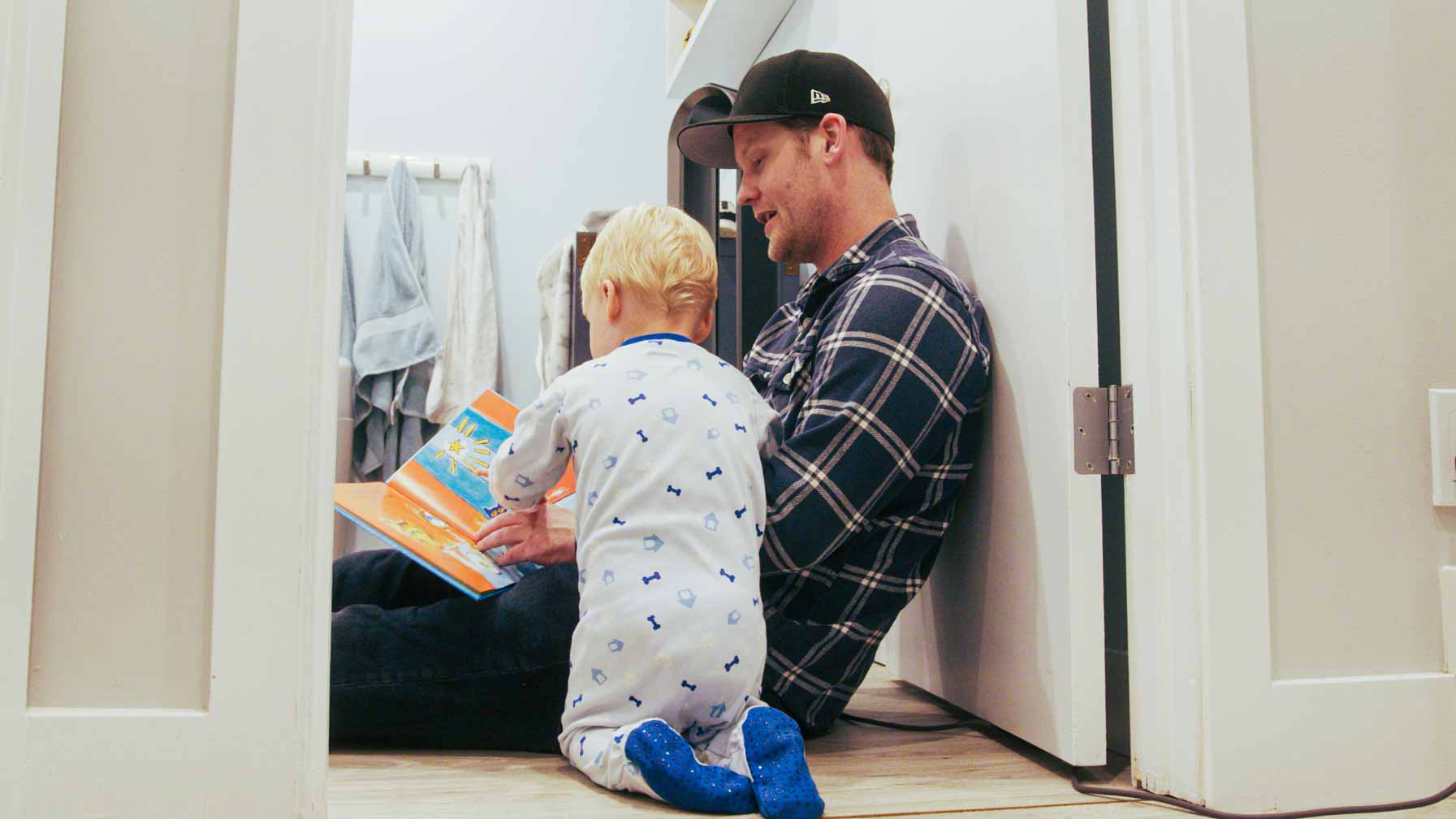 Matthew and Beckett reading a book