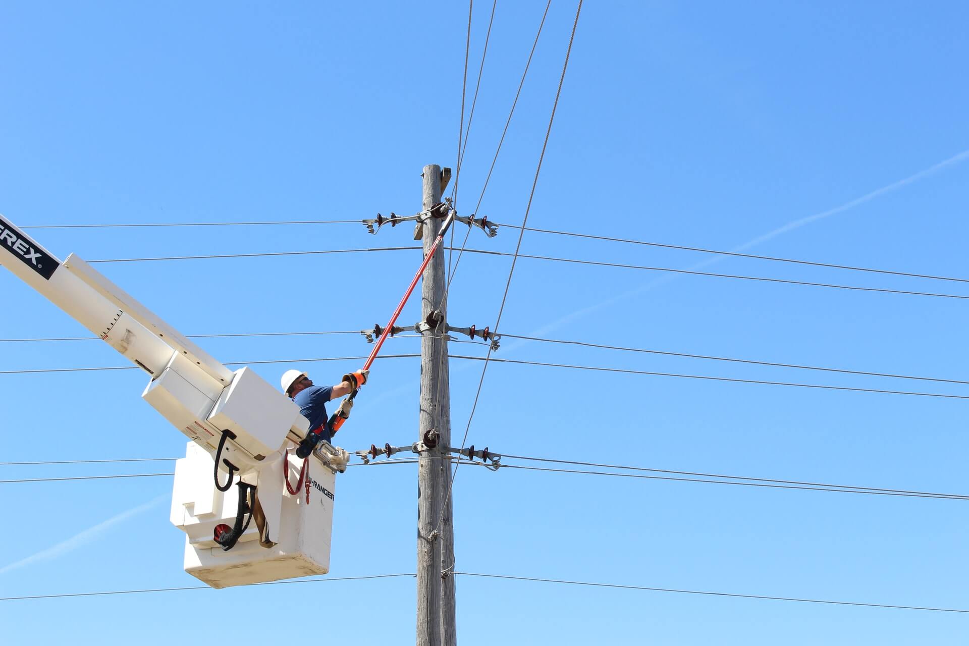 Hydro technician repairing lines