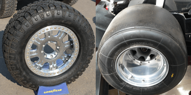 On the left, an off-road tire with deep treads, on the right a racing slick with a smooth tread surface